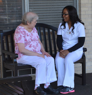 nurse and patient talking outside