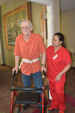 nurse assisting patient in rehab care